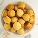 Cornbread muffins in white bowl.