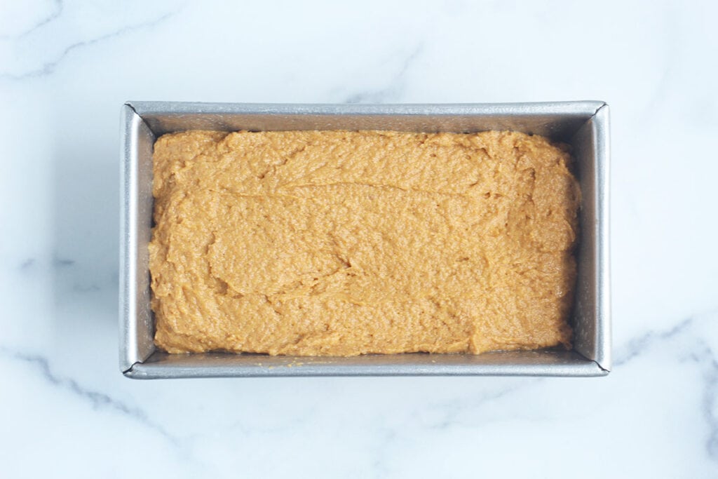batter for healthy pumpkin bread in baking pan.