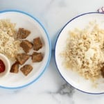 Mini meatloaves and sides on white plates.
