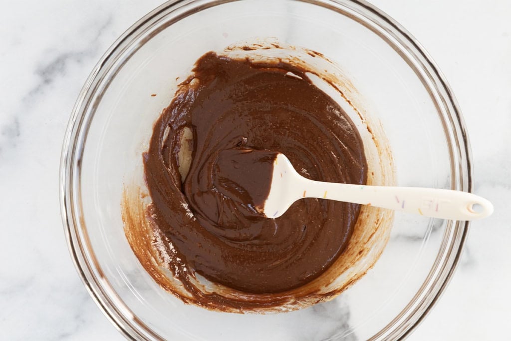 Chocolate mixture for no bake chocolate cookies in glass bowl.