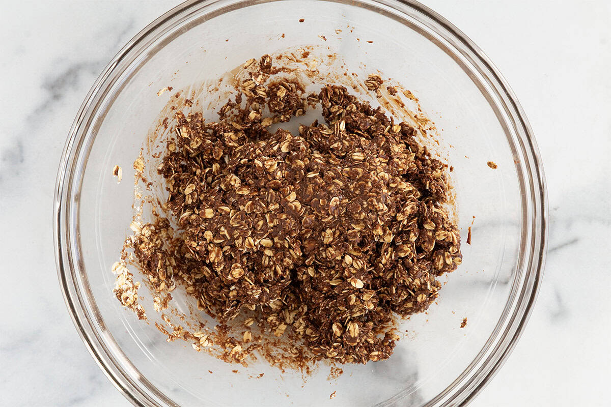 Dough for no bake chocolate cookies in glass bowl.