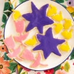 Frosted easter cookies on white plate.
