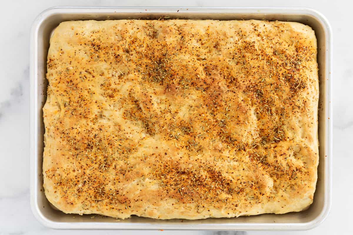 baked focaccia bread in baking pan.