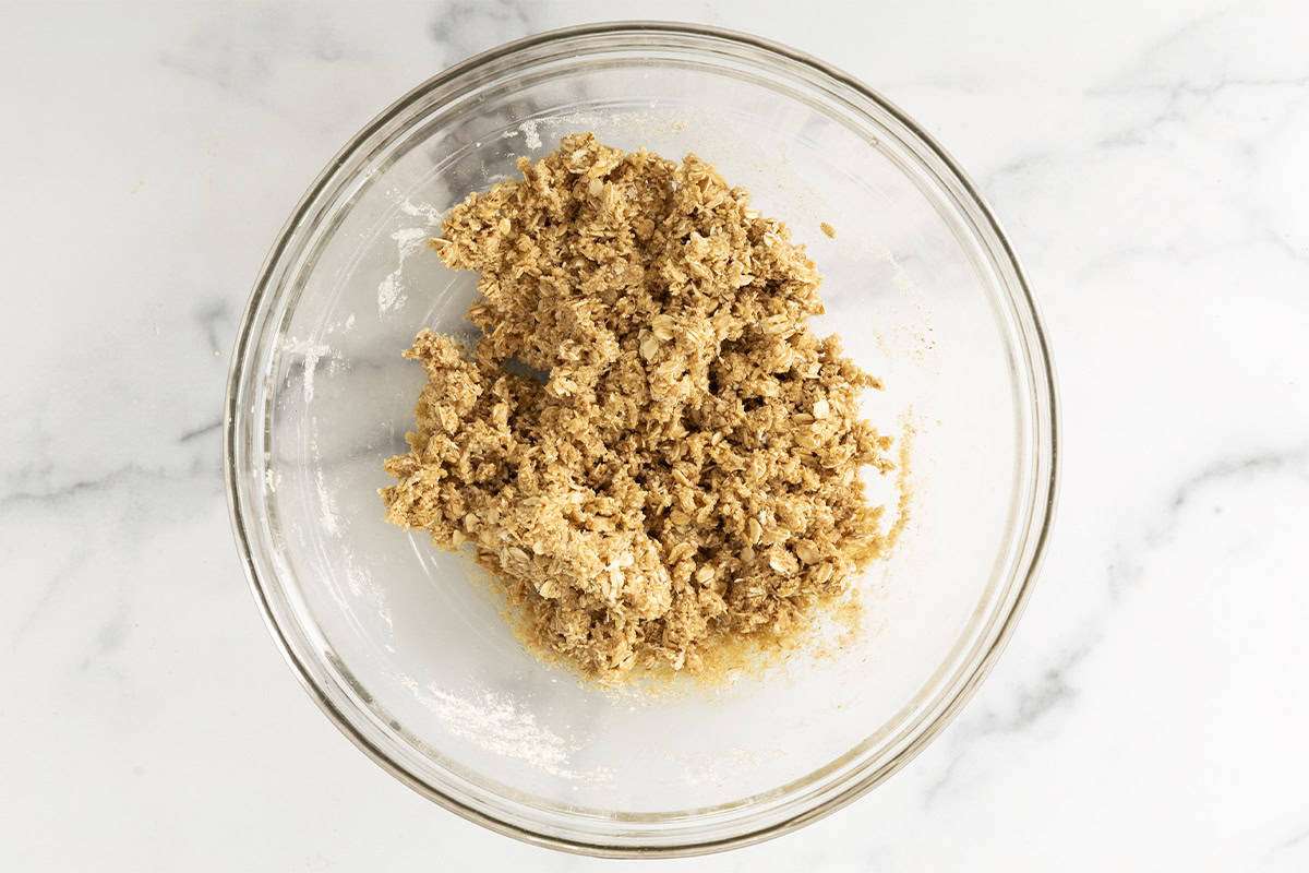Batter for crunchy granola bars in glass bowl.