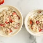 Strawberries and cream oatmeal in two bowls.