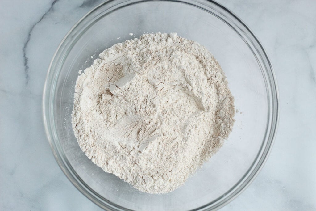 dry ingredients for lemon blueberry muffins in bowl.