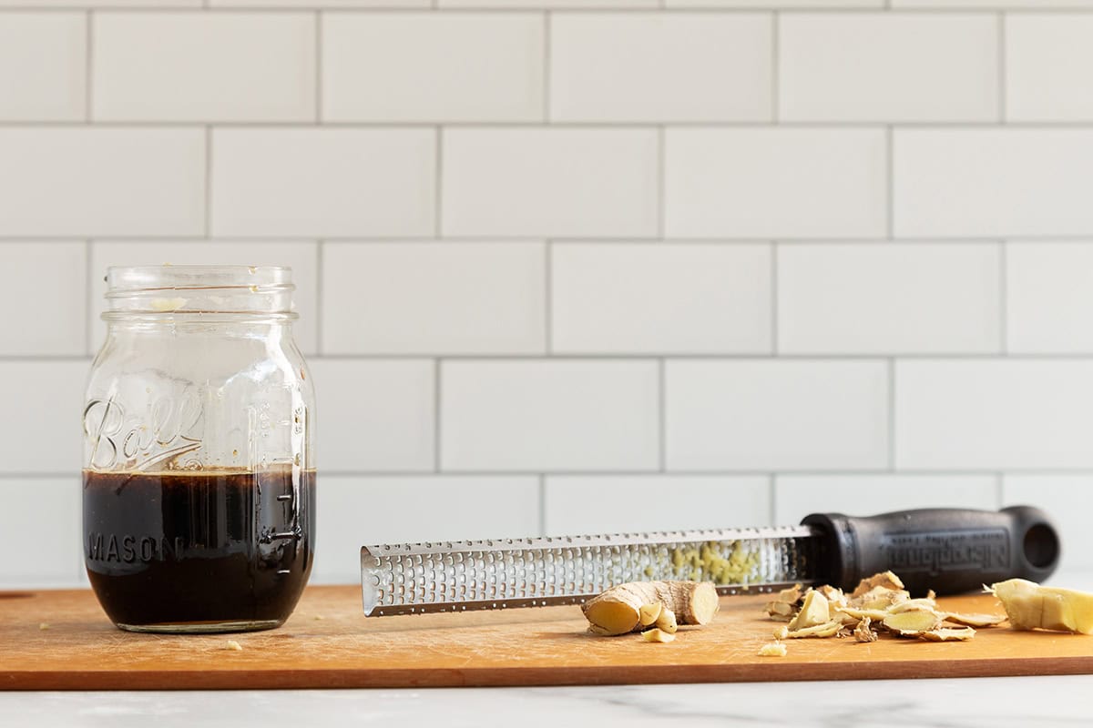 Making teriyaki sauce on cutting board.