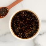 Teriyaki sauce in bowl with spoon on side.