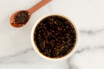 Teriyaki sauce in bowl with spoon on side.