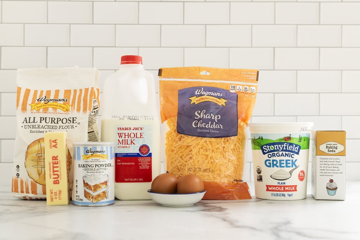 Ingredients for cheese muffins on countertop.
