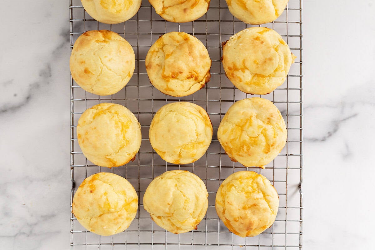 Cheese muffins on cooling rack.