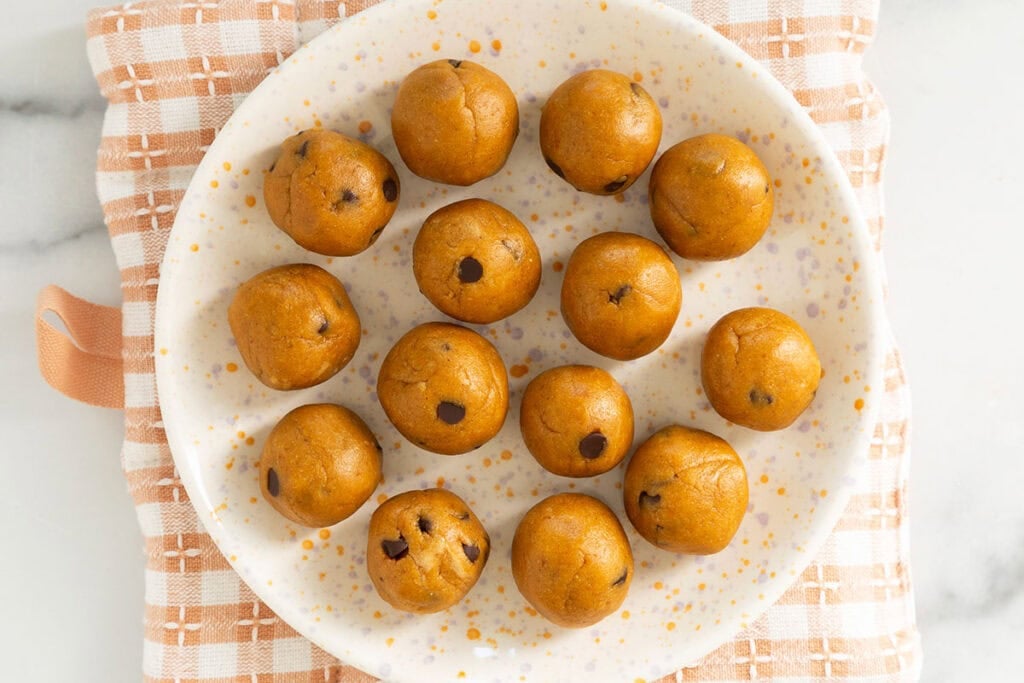 pumpkin protein balls on plate.