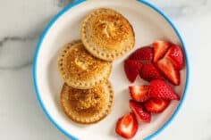 pizza uncrustables on plate with blue rim.
