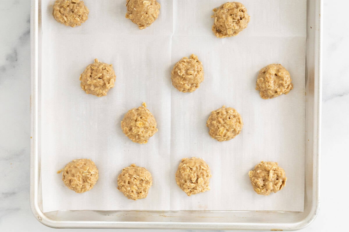 Applesauce cookies on sheet pan before baking.