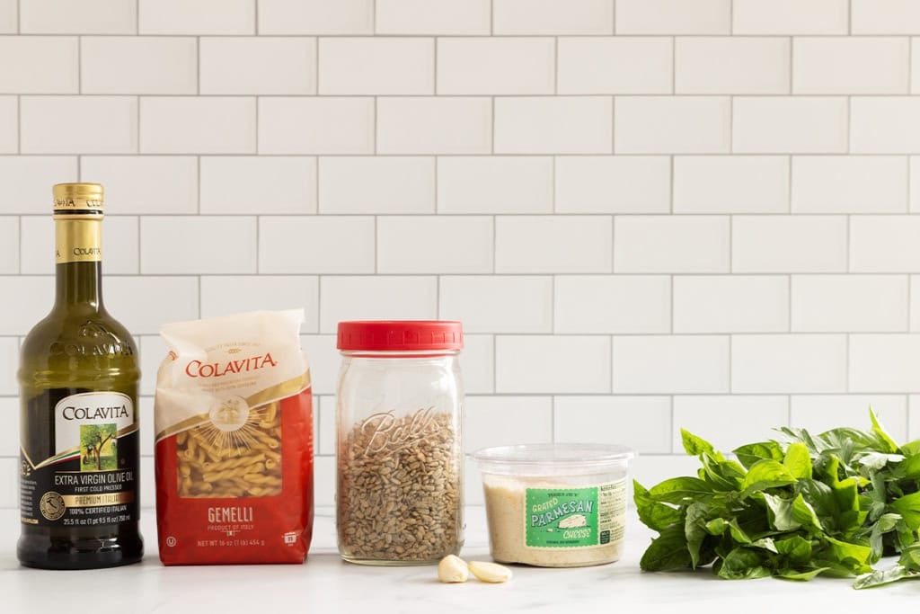 Ingredients for nut free pesto on countertop.