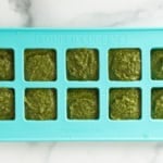 Nut free pesto in ice cube tray before freezing.