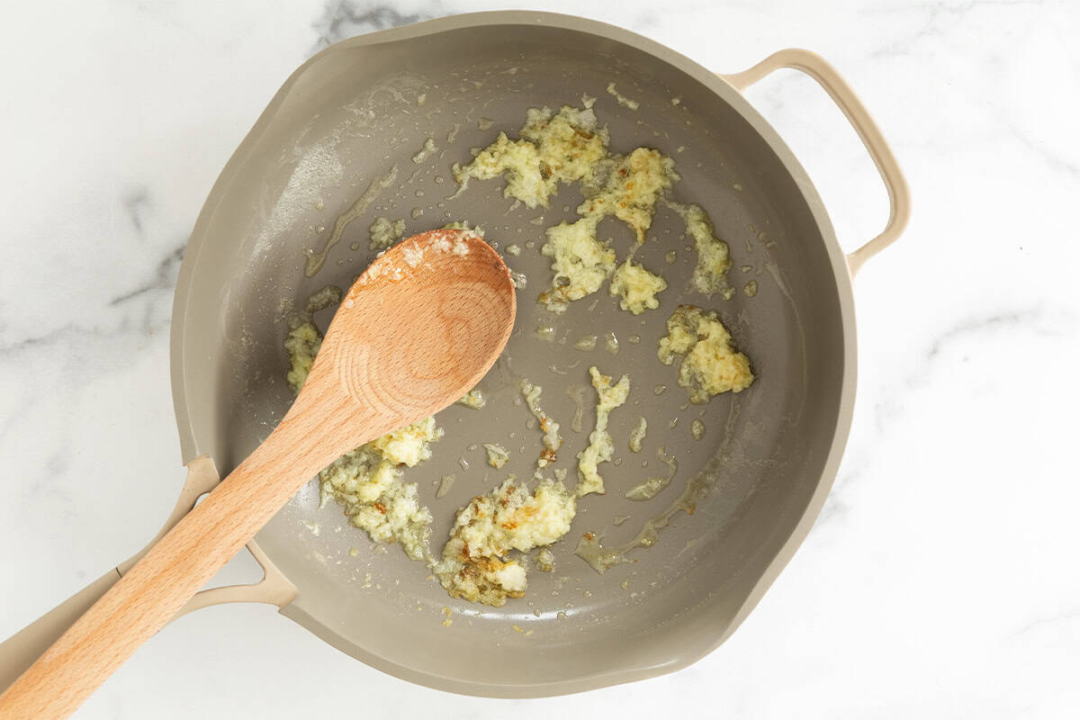 Garlic and onion in frying pan for spaghettios.
