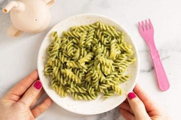 nut free pesto on plate with pink fork.