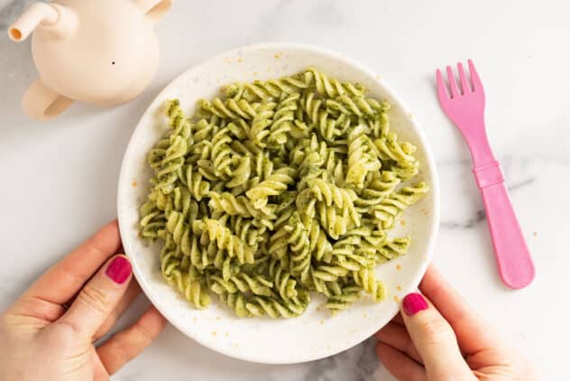 nut free pesto on plate with pink fork.