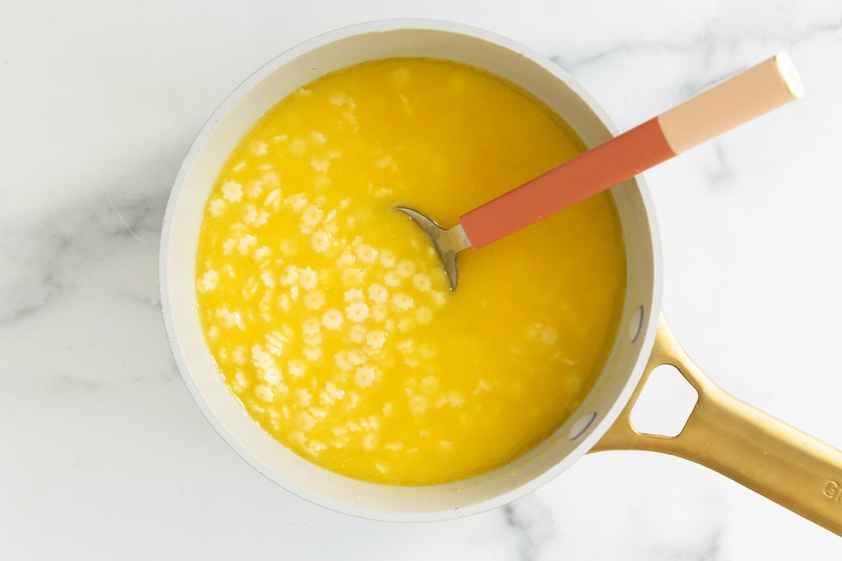 Baby soup in pot with spoon.