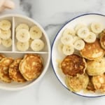 Banana yogurt pancakes on two plates with banana slices.