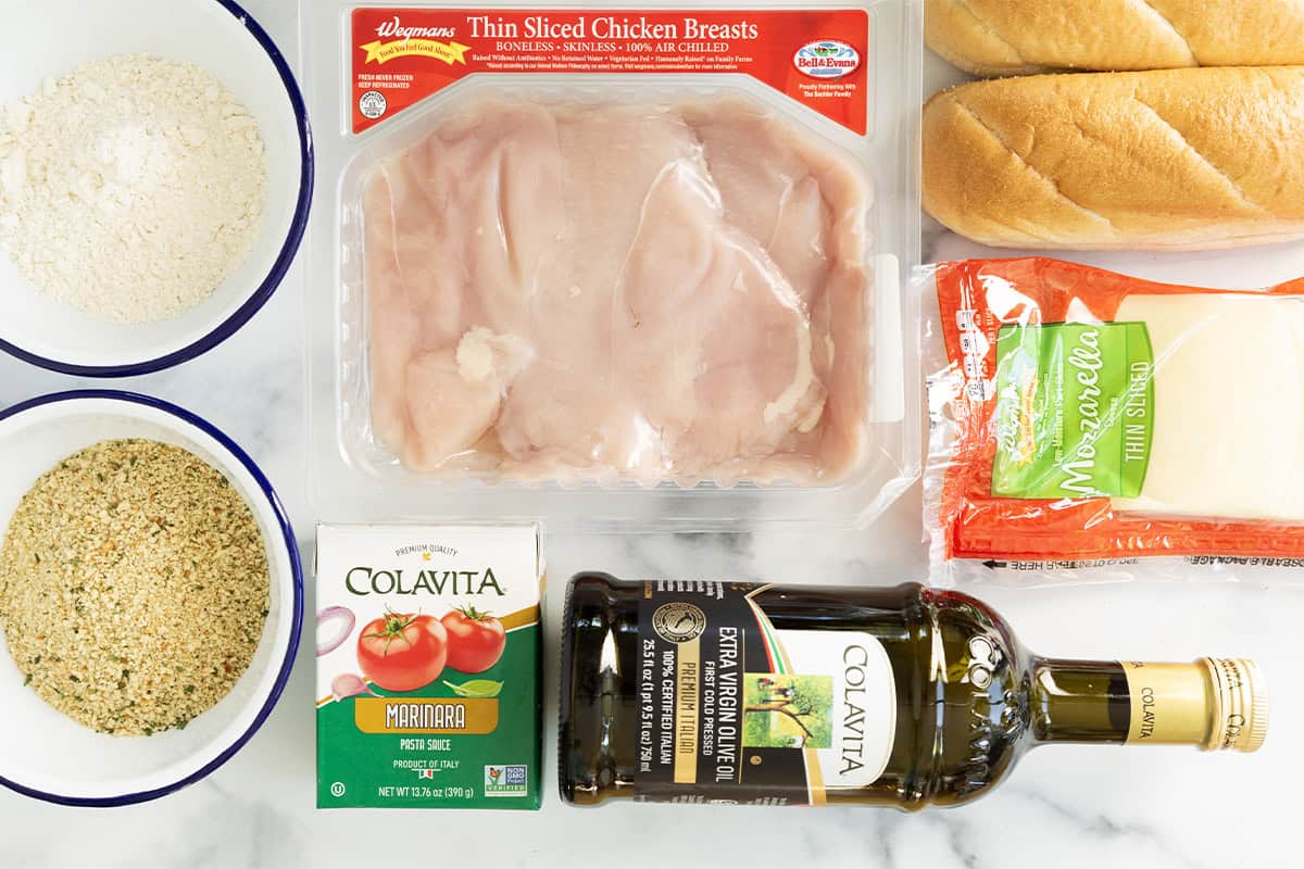 Ingredients for chicken cutlet sandwiches on countertop.