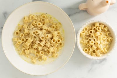 Creamy pasta soup in two bowls.