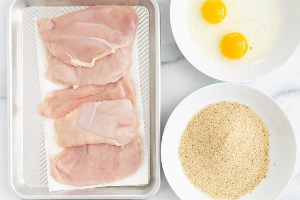 chicken cutlet ingredients on counter.