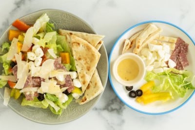 Pizza salad on two plates.