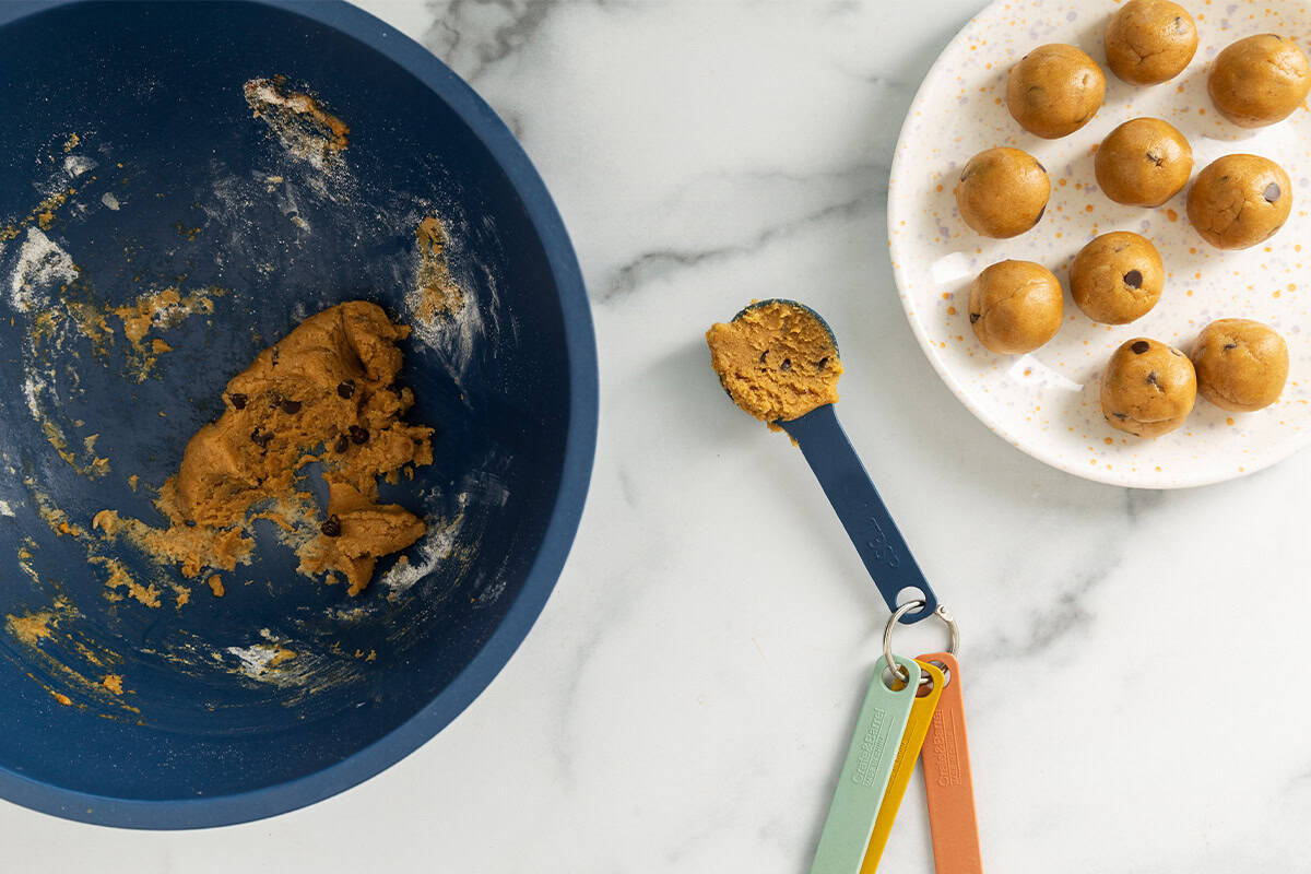 Making pumpkin protein balls with tablespoon.