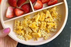 banza pasta on pink plate with sauce.