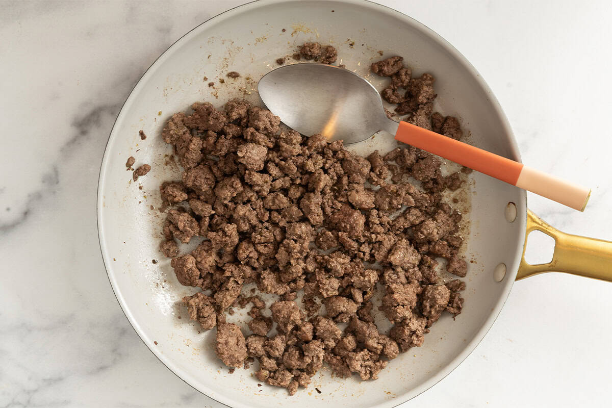 Ground beef in pan for cheeseburger salad