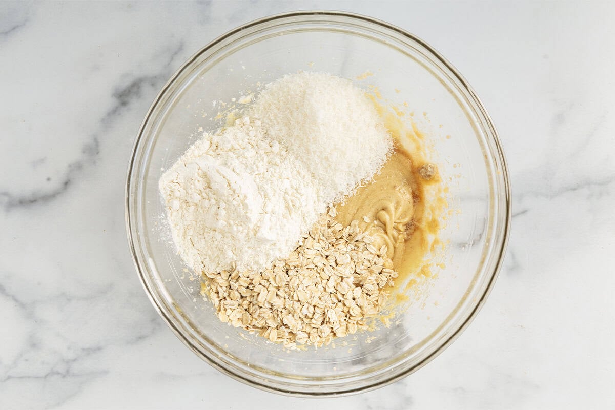 Dry ingredients for cherry chocolate chip cookies in glass bowl.