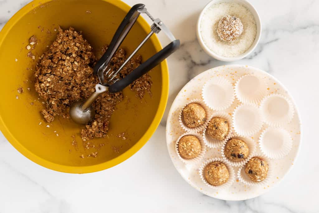 Making almond butter protein balls with cookie scoop.