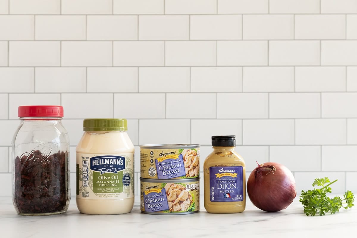Ingredients for chicken salad on countertop.