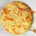 creamy chicken noodle soup in pot.