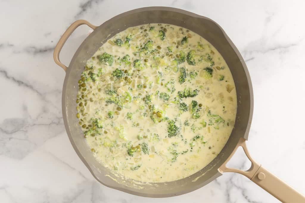 Broccoli and cheddar soup in pot.