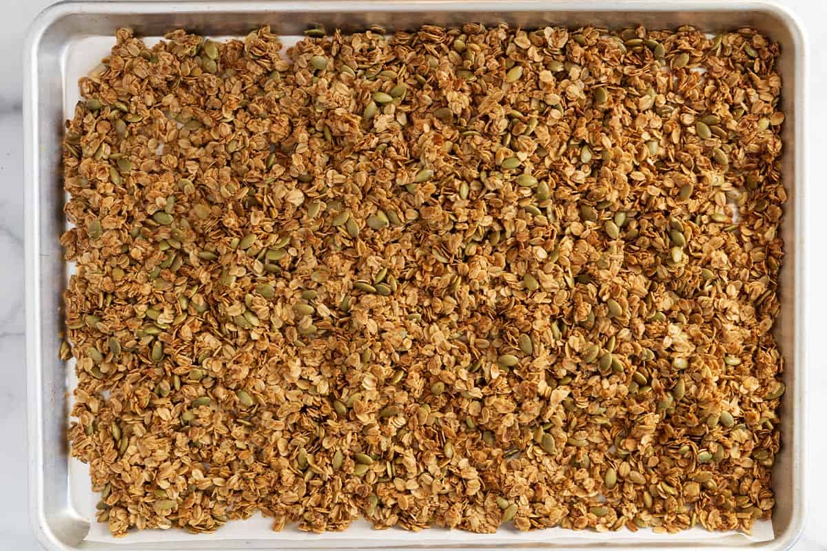Olive oil granola on baking sheet after baking.