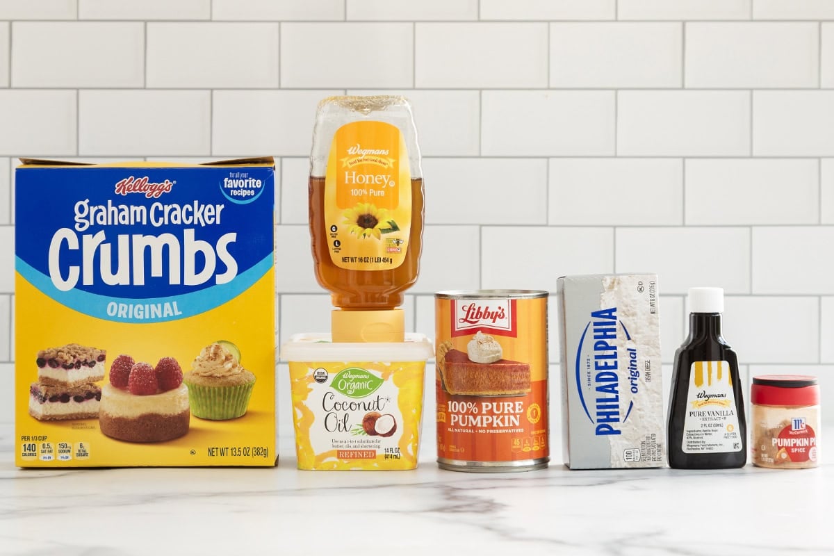 Ingredients for pumpkin cheesecake bites on countertop.