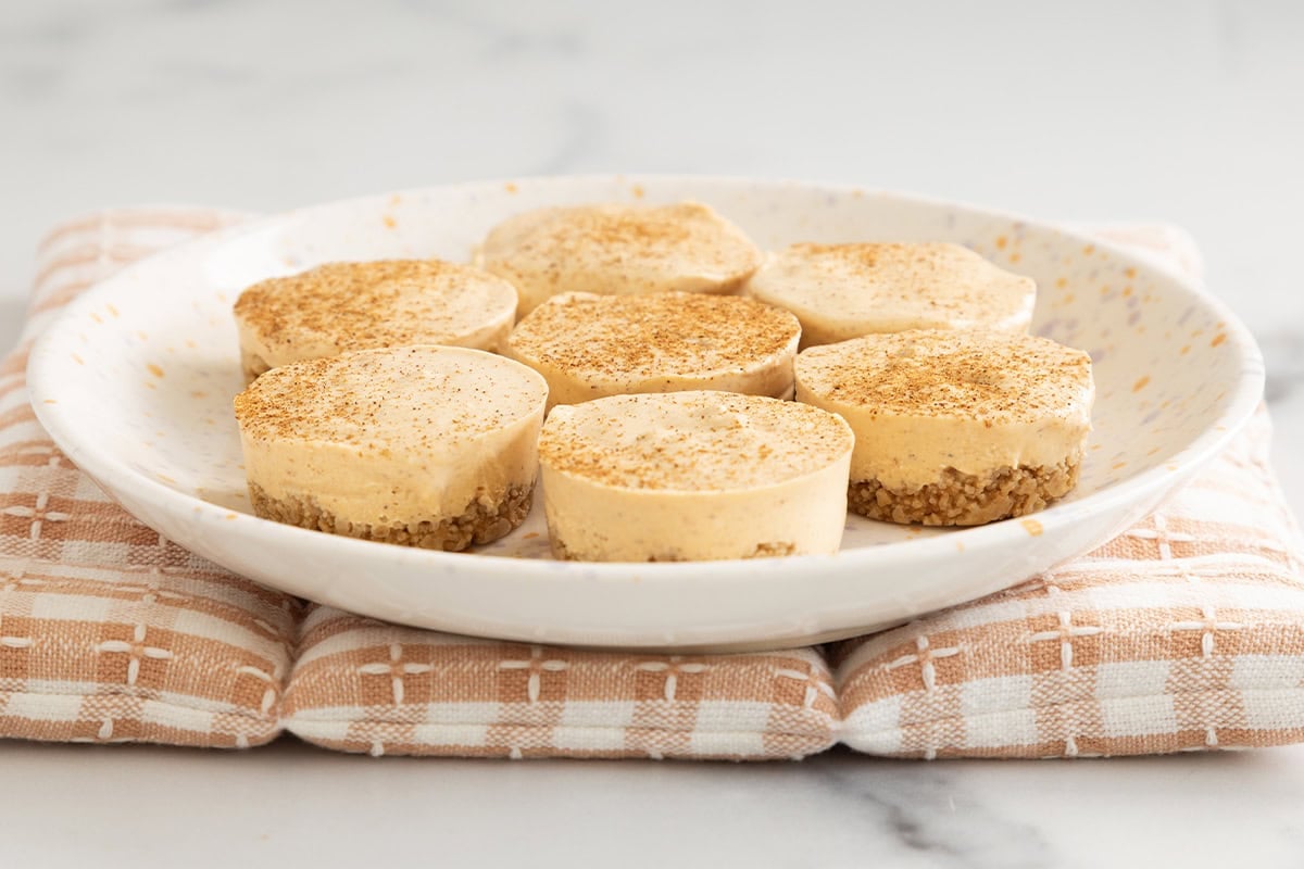 Pumpkin cheesecake bites on plate. 
