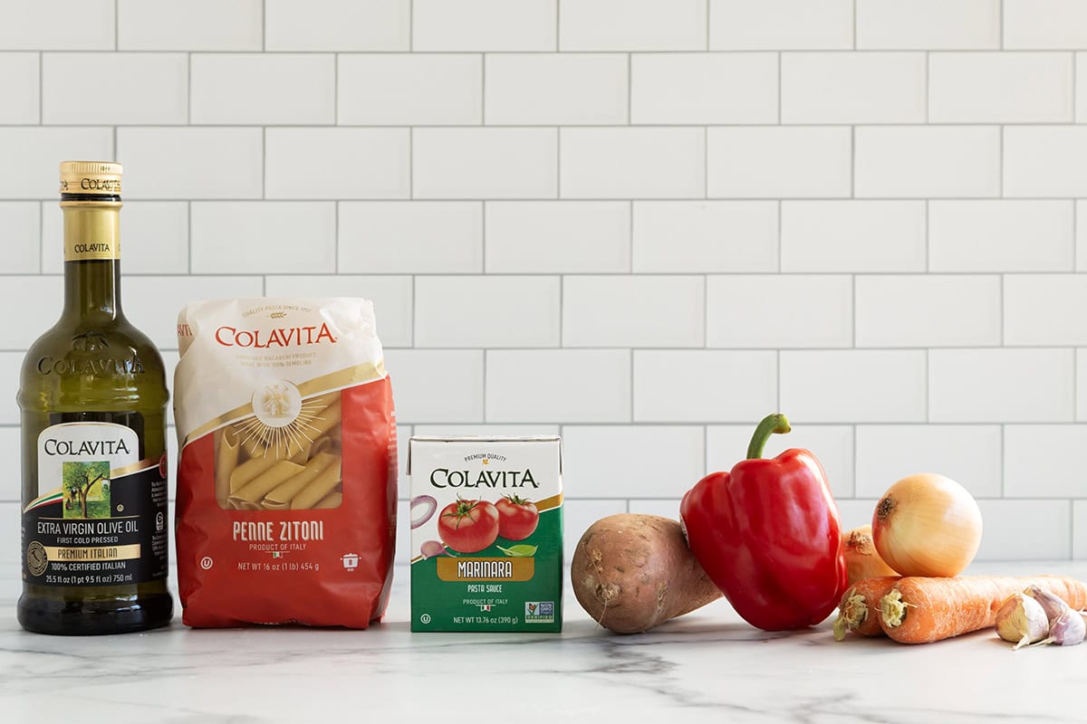 Ingredients for roasted vegetable pasta sauce on countertop.