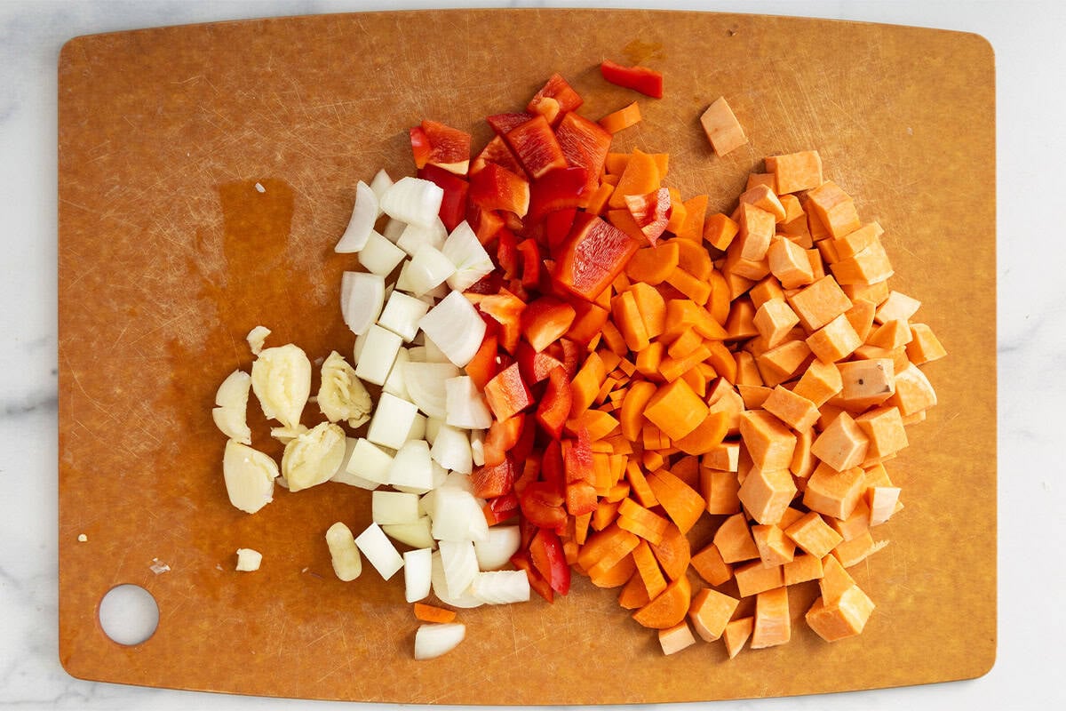 Chopped veggies on cutting board for roasted vegetable pasta.