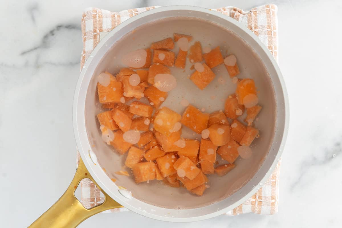 Sweet potato cubes in water for sweet potato oatmeal.