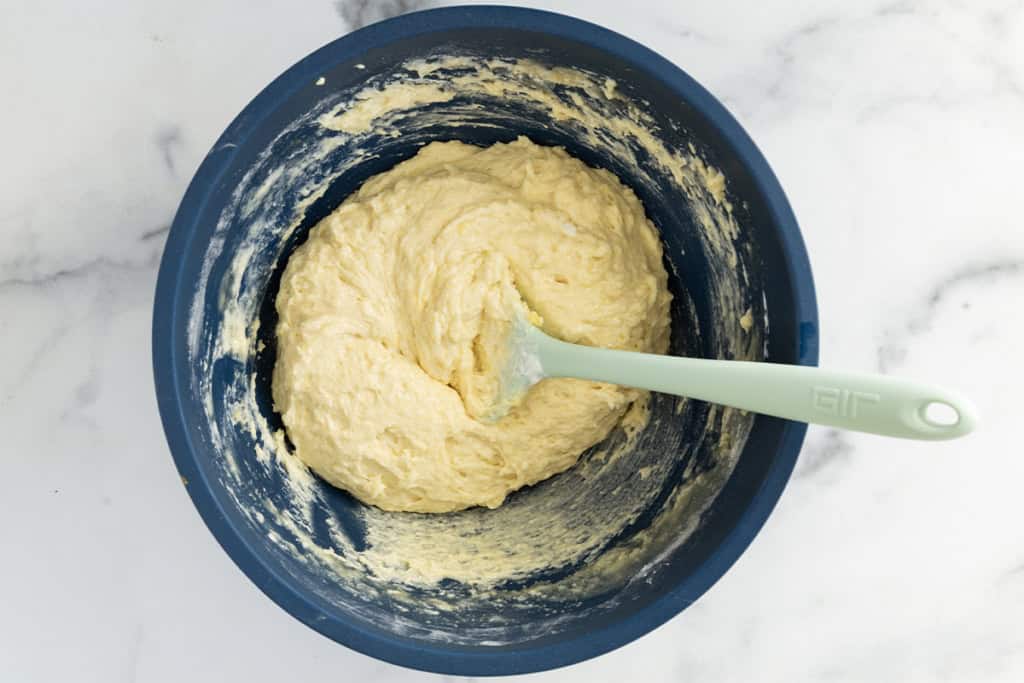 Batter for yogurt cupcakes in blue bowl.
