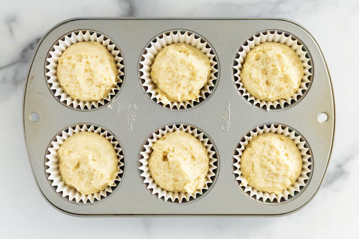 Yogurt cupcakes in muffin pan before baking.