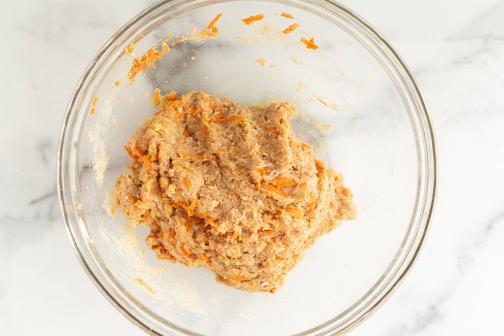 Asian chicken meatball mixture in glass bowl.
