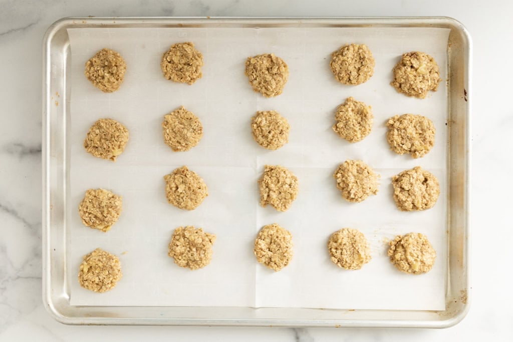 Banana oatmeal cookies on baking tray before baking.