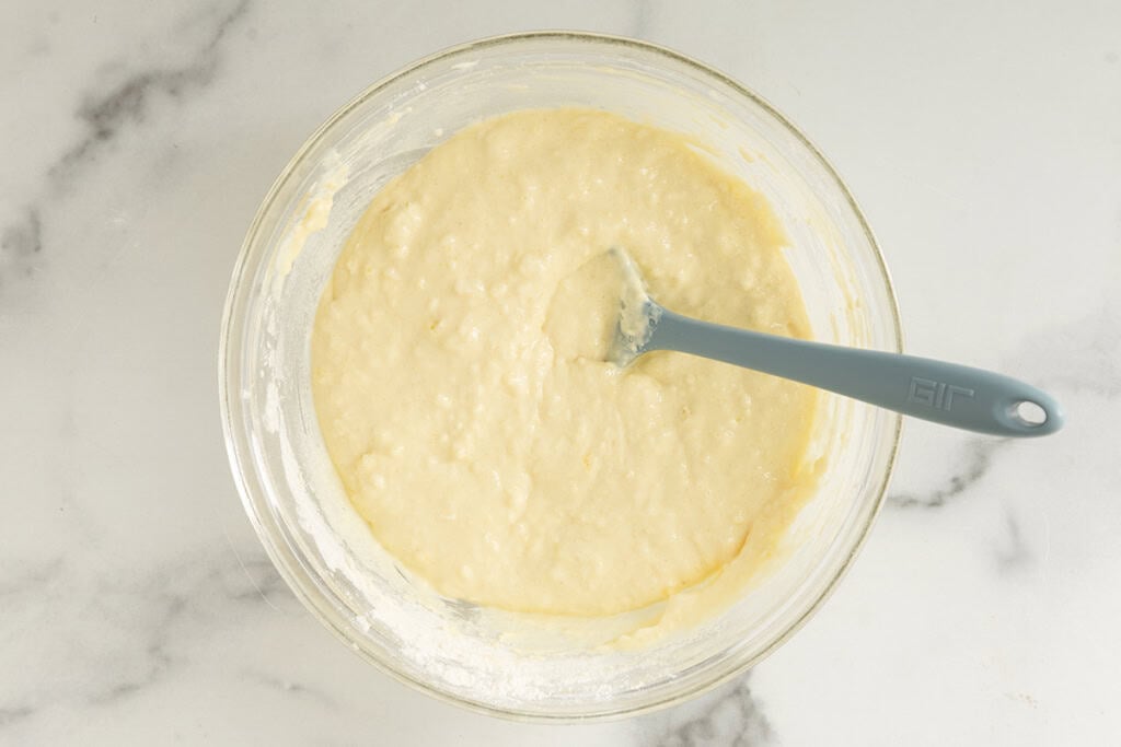 Batter for chocolate chip waffles in glass bowl.