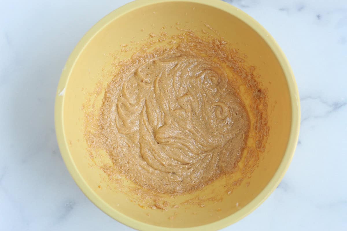 wet ingredients for healthy oatmeal chocolate chip cookies in yellow bowl.