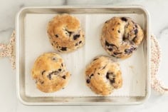 Blueberry Bagels on baking sheet after baking.